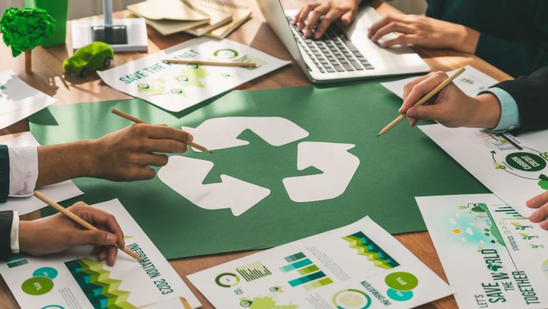 Business team looking at recycling documents